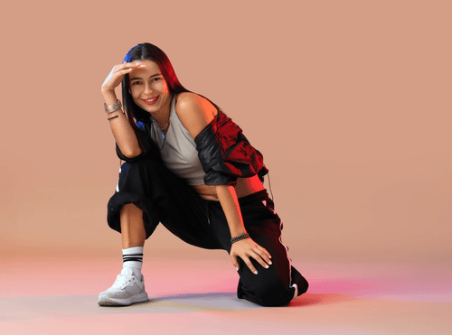 Hip hop dancer posing in streetwear
